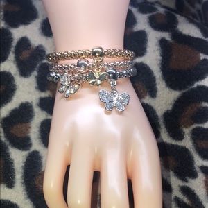 Link chain style bracelets with charms